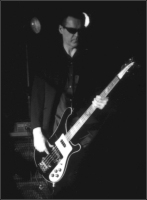 Ade Carver - Dosch bass player during 2001 to 2004. Owner of the longest guitar strap in the world - Now with Cool Canasta. 